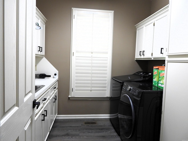 22 Talais Dr, Little Rock, AR 72223 - washroom featuring dark wood-style floors, separate washer and dryer, cabinet space, baseboards, and visible vents
