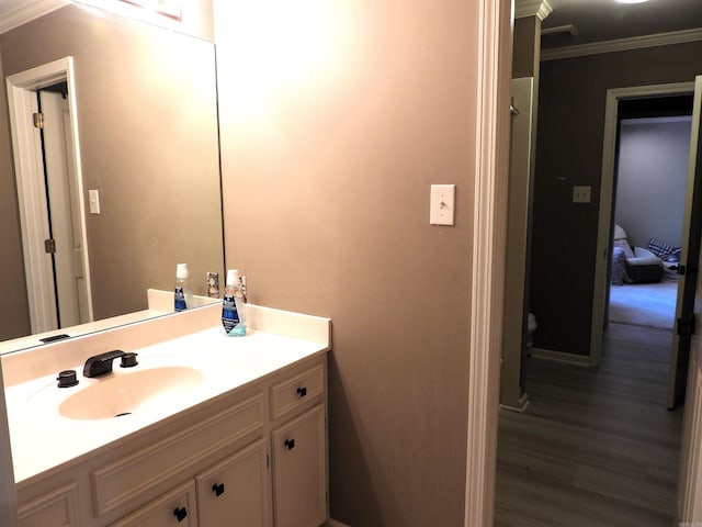 22 Talais Dr, Little Rock, AR 72223 - bathroom with wood finished floors, vanity, and ornamental molding