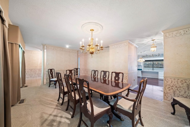 118 Grandview Dr, Hot Springs, AR 71913 - carpeted dining room featuring a chandelier, wallpapered walls, a textured ceiling, and visible vents