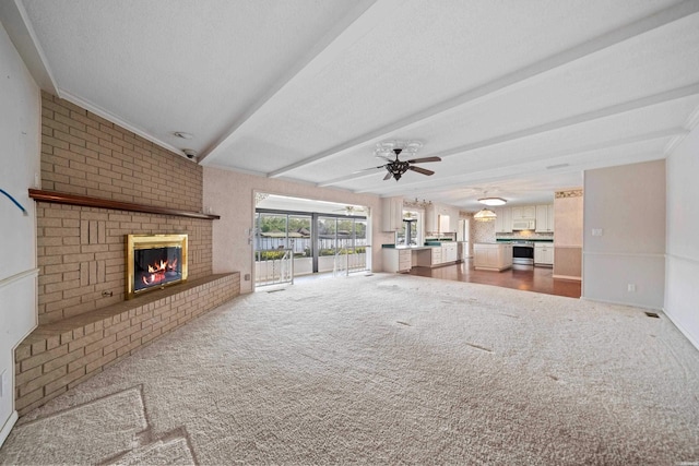 118 Grandview Dr, Hot Springs, AR 71913 - unfurnished living room with beam ceiling, a fireplace, carpet, and a ceiling fan