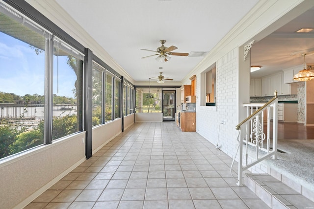 118 Grandview Dr, Hot Springs, AR 71913 - unfurnished sunroom featuring tile patterned floors, a water view, and ornamental molding