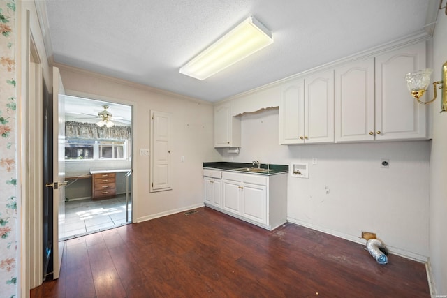 118 Grandview Dr, Hot Springs, AR 71913 - washroom featuring a sink, dark wood-style flooring, washer hookup, cabinet space, and electric dryer hookup