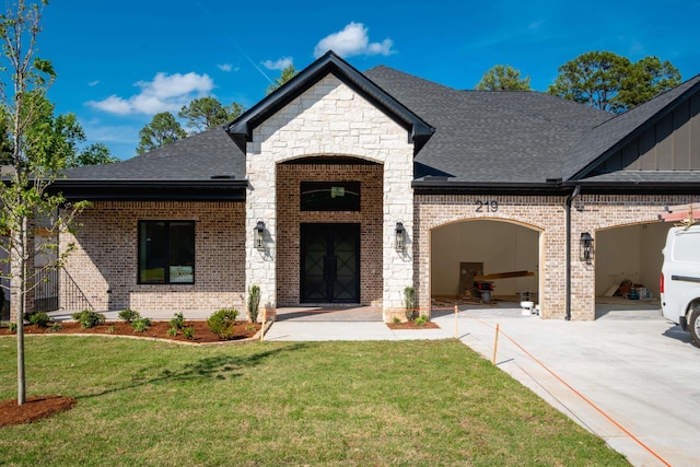 219 Abington Cir, Little Rock, AR 72223 - view of front of home with an attached garage, concrete driveway, a shingled roof, a front lawn, and brick siding