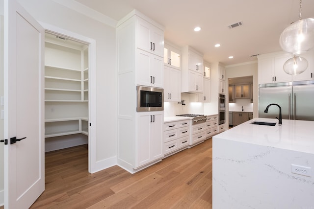 219 Abington Cir, Little Rock, AR 72223 - kitchen featuring a sink, built in appliances, visible vents, recessed lighting, and light wood-style floors
