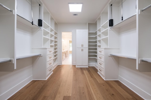 219 Abington Cir, Little Rock, AR 72223 - walk in closet with visible vents and light wood-type flooring