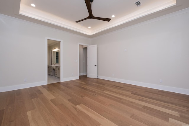219 Abington Cir, Little Rock, AR 72223 - unfurnished room featuring light wood-style flooring, a ceiling fan, visible vents, a raised ceiling, and recessed lighting
