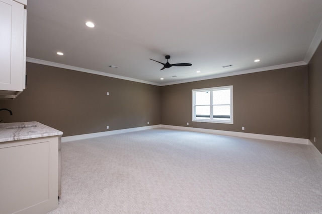 219 Abington Cir, Little Rock, AR 72223 - unfurnished living room featuring a sink, crown molding, light carpet, a ceiling fan, and baseboards
