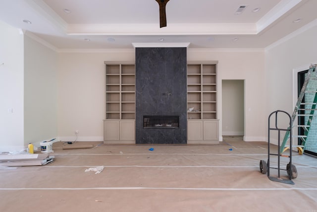 219 Abington Cir, Little Rock, AR 72223 - unfurnished living room with a premium fireplace, visible vents, a tray ceiling, and crown molding