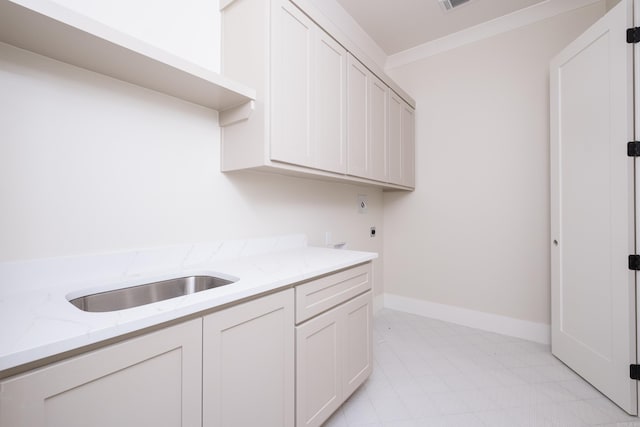 219 Abington Cir, Little Rock, AR 72223 - washroom with a sink, cabinet space, visible vents, electric dryer hookup, and baseboards