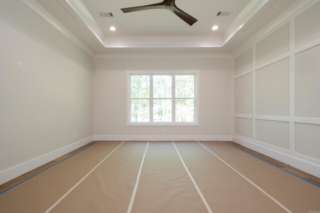 219 Abington Cir, Little Rock, AR 72223 - empty room with a ceiling fan, a raised ceiling, and visible vents