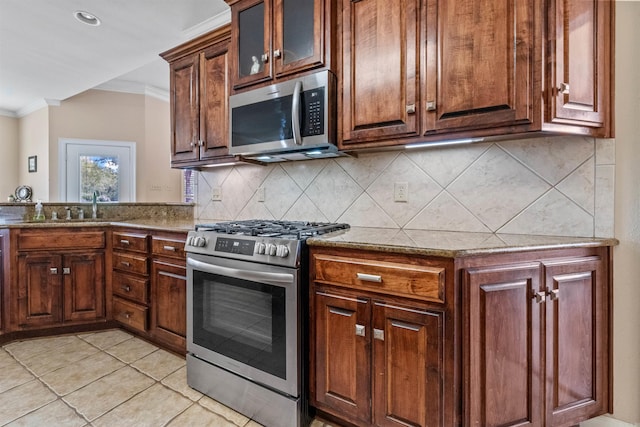 109 Sandstone Cv, Sherwood, AR 72120 - kitchen featuring light stone counters, stainless steel appliances, a sink, crown molding, and decorative backsplash