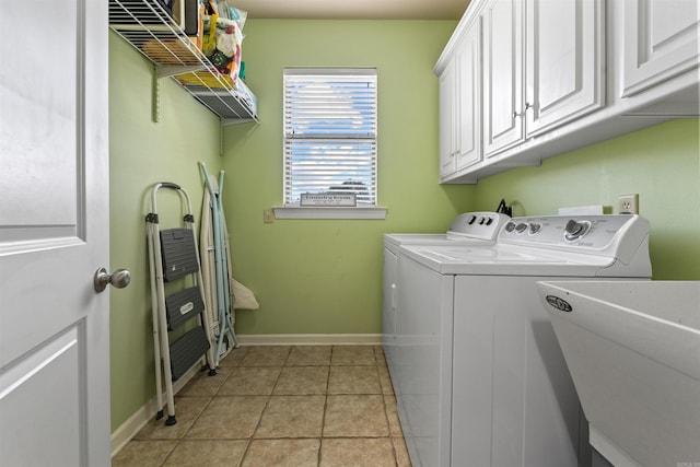 109 Sandstone Cv, Sherwood, AR 72120 - laundry room with a sink, separate washer and dryer, light tile patterned floors, cabinet space, and baseboards