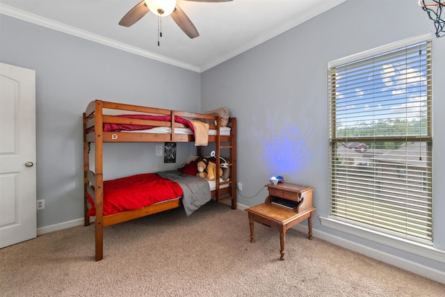 109 Sandstone Cv, Sherwood, AR 72120 - carpeted bedroom featuring ceiling fan, baseboards, crown molding, and multiple windows