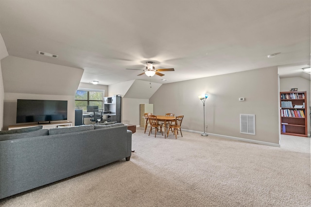 109 Sandstone Cv, Sherwood, AR 72120 - carpeted living area with vaulted ceiling, visible vents, and a ceiling fan