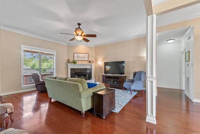 109 Sandstone Cv, Sherwood, AR 72120 - living area with a tile fireplace, dark wood-style floors, and decorative columns