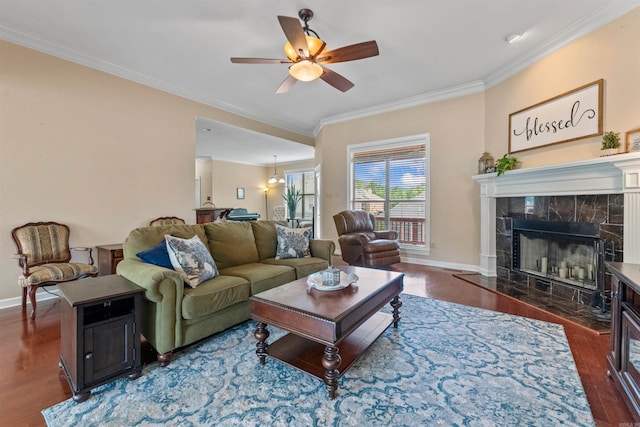 109 Sandstone Cv, Sherwood, AR 72120 - living room with wood finished floors, crown molding, baseboards, and ceiling fan