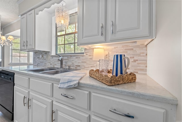 8302 Merriwood Ct, Sherwood, AR 72120 - kitchen featuring an inviting chandelier, backsplash, dishwasher, a sink, and white cabinetry