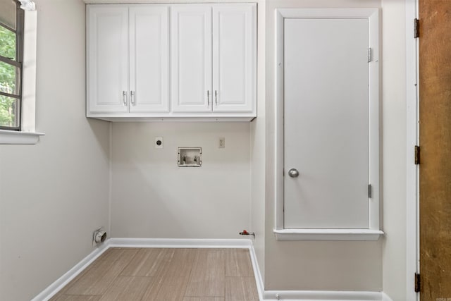 8302 Merriwood Ct, Sherwood, AR 72120 - laundry room featuring cabinet space, hookup for a washing machine, baseboards, and electric dryer hookup