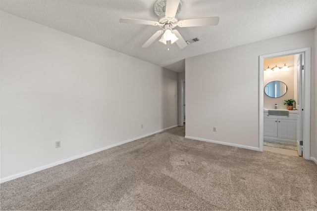 8302 Merriwood Ct, Sherwood, AR 72120 - unfurnished bedroom featuring carpet flooring, a textured ceiling, baseboards, visible vents, and connected bathroom