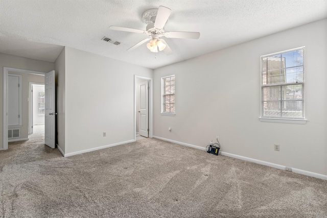 8302 Merriwood Ct, Sherwood, AR 72120 - unfurnished bedroom featuring baseboards, visible vents, carpet, and a textured ceiling