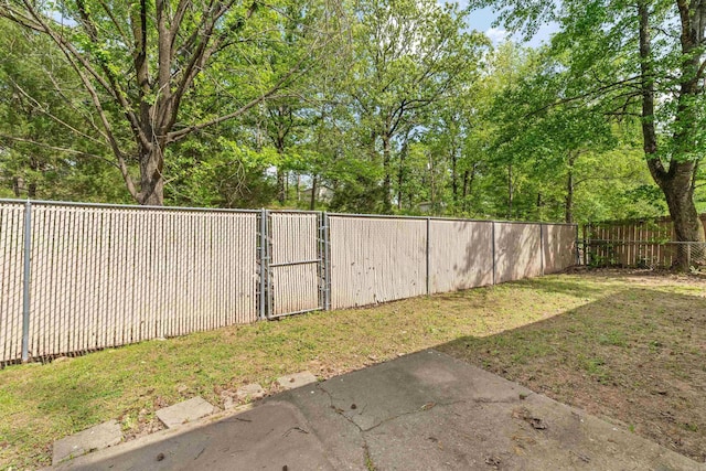8302 Merriwood Ct, Sherwood, AR 72120 - view of yard featuring a gate and a fenced backyard