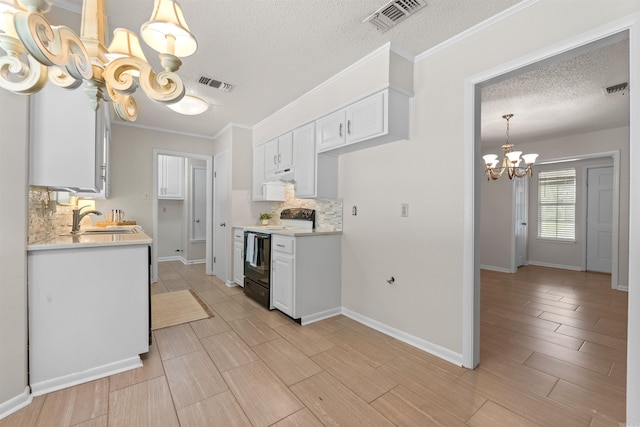 8302 Merriwood Ct, Sherwood, AR 72120 - kitchen featuring a notable chandelier, range with electric stovetop, visible vents, and a textured ceiling