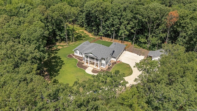 drone / aerial view with a view of trees