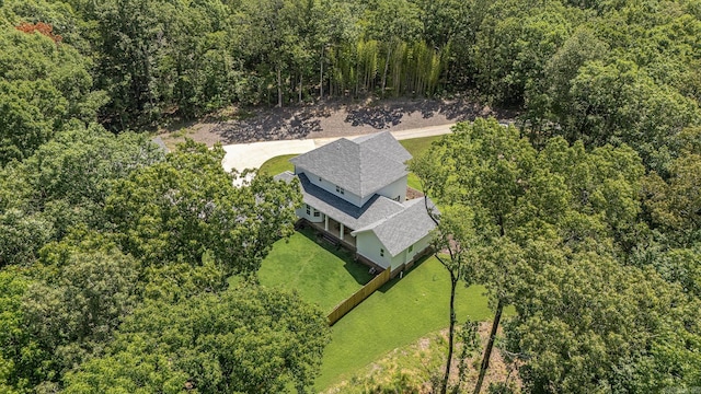 drone / aerial view featuring a forest view