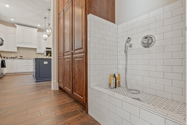 kitchen featuring recessed lighting, dark wood-style floors, an inviting chandelier, light countertops, and white cabinetry