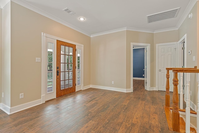 entryway with baseboards, visible vents, dark wood-style floors, and ornamental molding