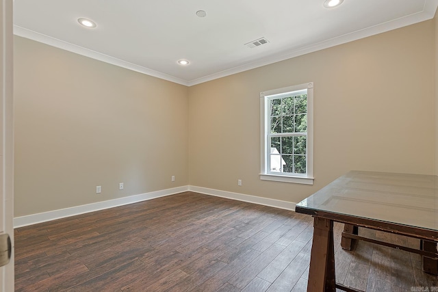 empty room with dark wood-style floors, baseboards, visible vents, recessed lighting, and crown molding