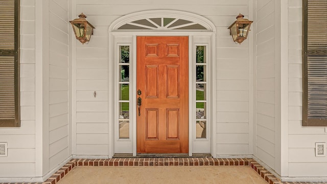 doorway to property featuring covered porch