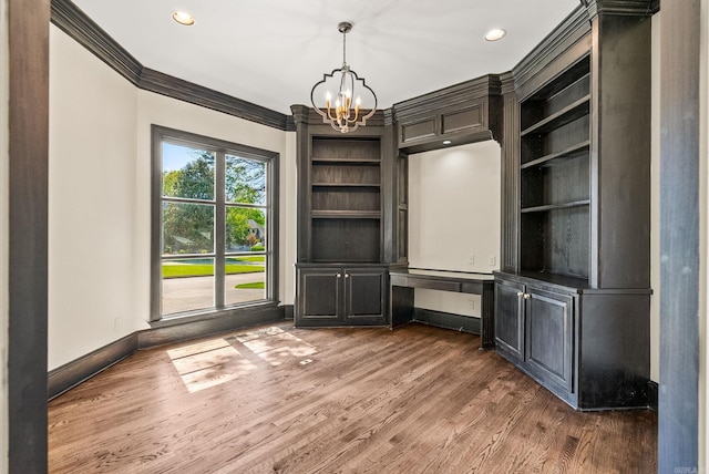 interior space with baseboards, recessed lighting, a chandelier, wood finished floors, and crown molding