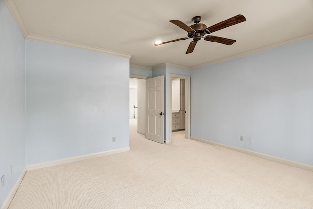 empty room with light carpet, a ceiling fan, baseboards, and ornamental molding