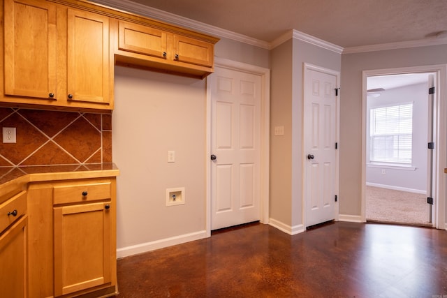 kitchen featuring decorative backsplash, baseboards, finished concrete floors, and tile counters