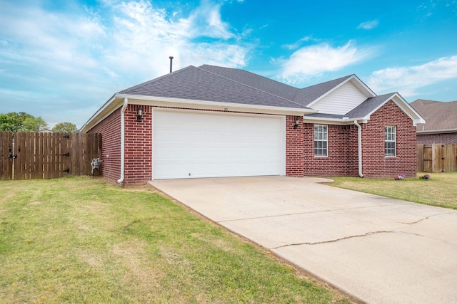 ranch-style house featuring fence, a shingled roof, a front lawn, brick siding, and a garage