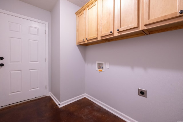laundry area featuring cabinet space, hookup for a washing machine, baseboards, and electric dryer hookup