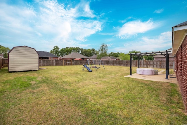 view of yard featuring a fenced backyard, a patio area, a shed, and a playground