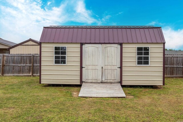 view of shed featuring a fenced backyard