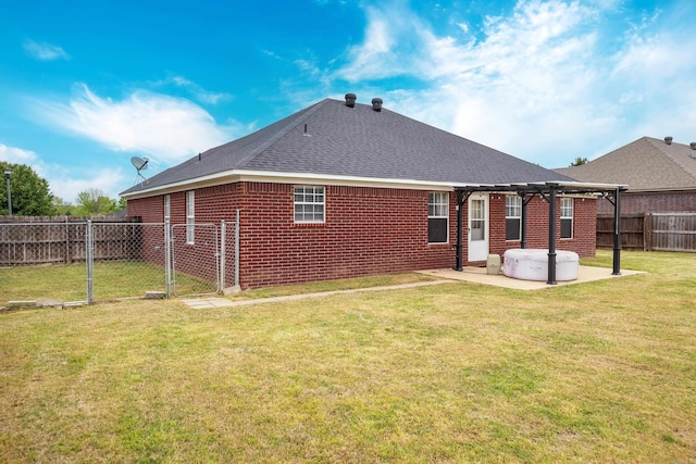 rear view of property featuring a fenced backyard, a pergola, brick siding, a yard, and a patio