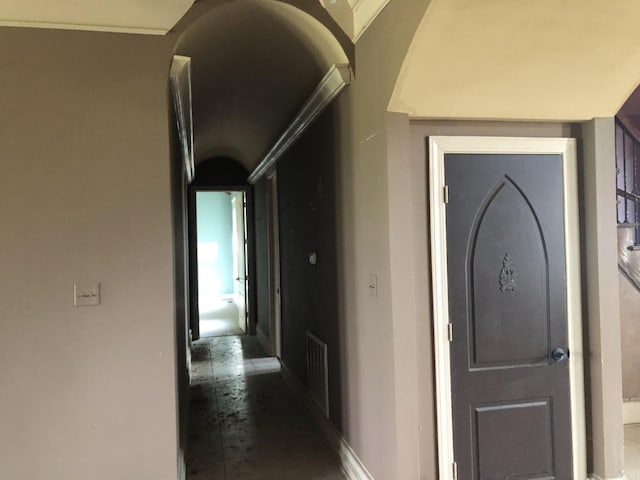 hall with baseboards and visible vents