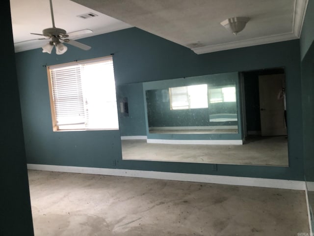 empty room featuring visible vents, crown molding, baseboards, and ceiling fan