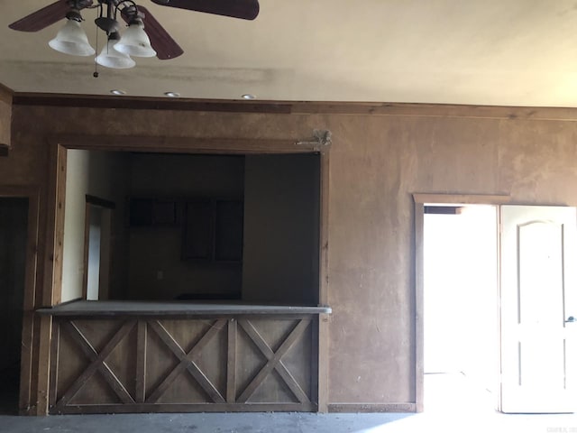 unfurnished room with a ceiling fan