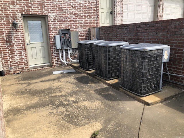 details with central AC unit and brick siding