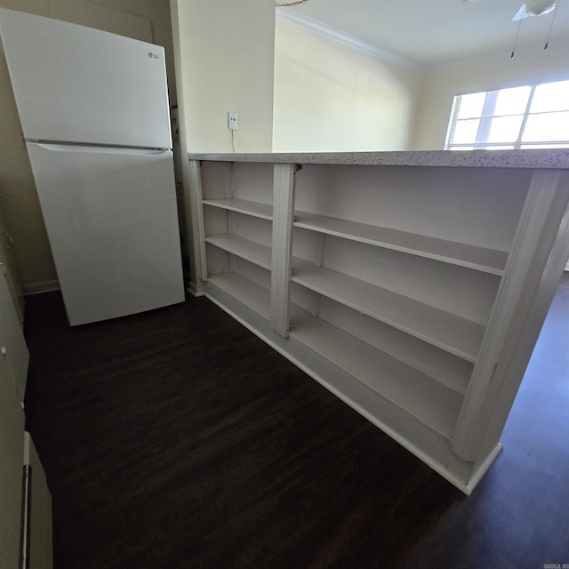 200 N Fillmore St, Little Rock, AR 72205 - room details featuring freestanding refrigerator, crown molding, and dark wood-style flooring