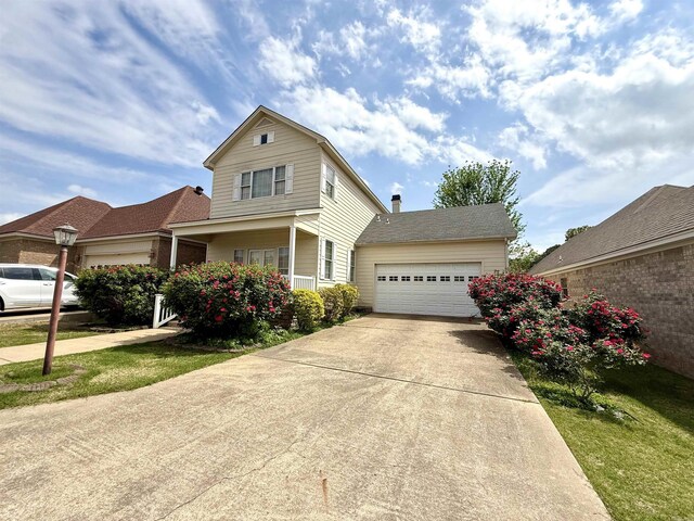 2308 Saxony Blvd, Searcy, AR 72143 - traditional-style house featuring concrete driveway, roof with shingles, and a garage