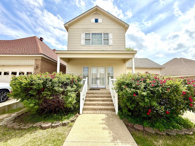 2308 Saxony Blvd, Searcy, AR 72143 - view of front of house with covered porch, french doors, and a garage