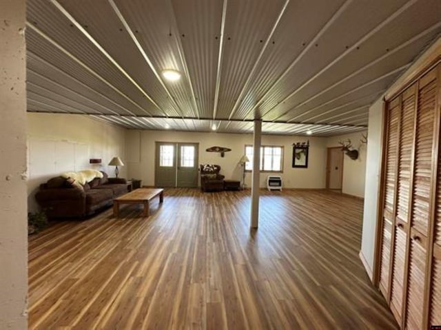 below grade area featuring a wealth of natural light and wood finished floors