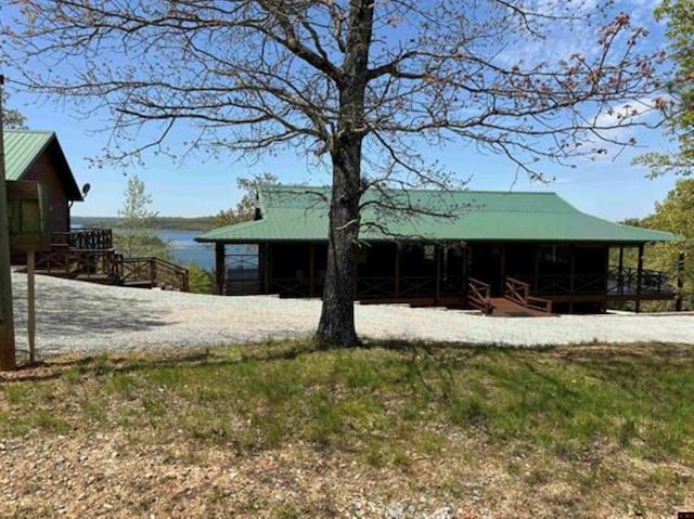exterior space with a water view