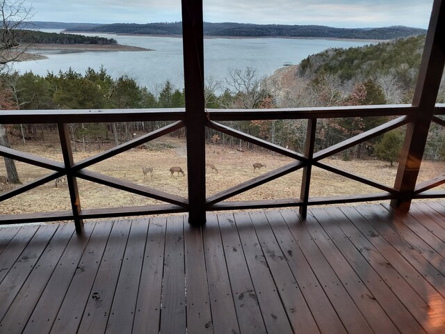 wooden terrace with a water view